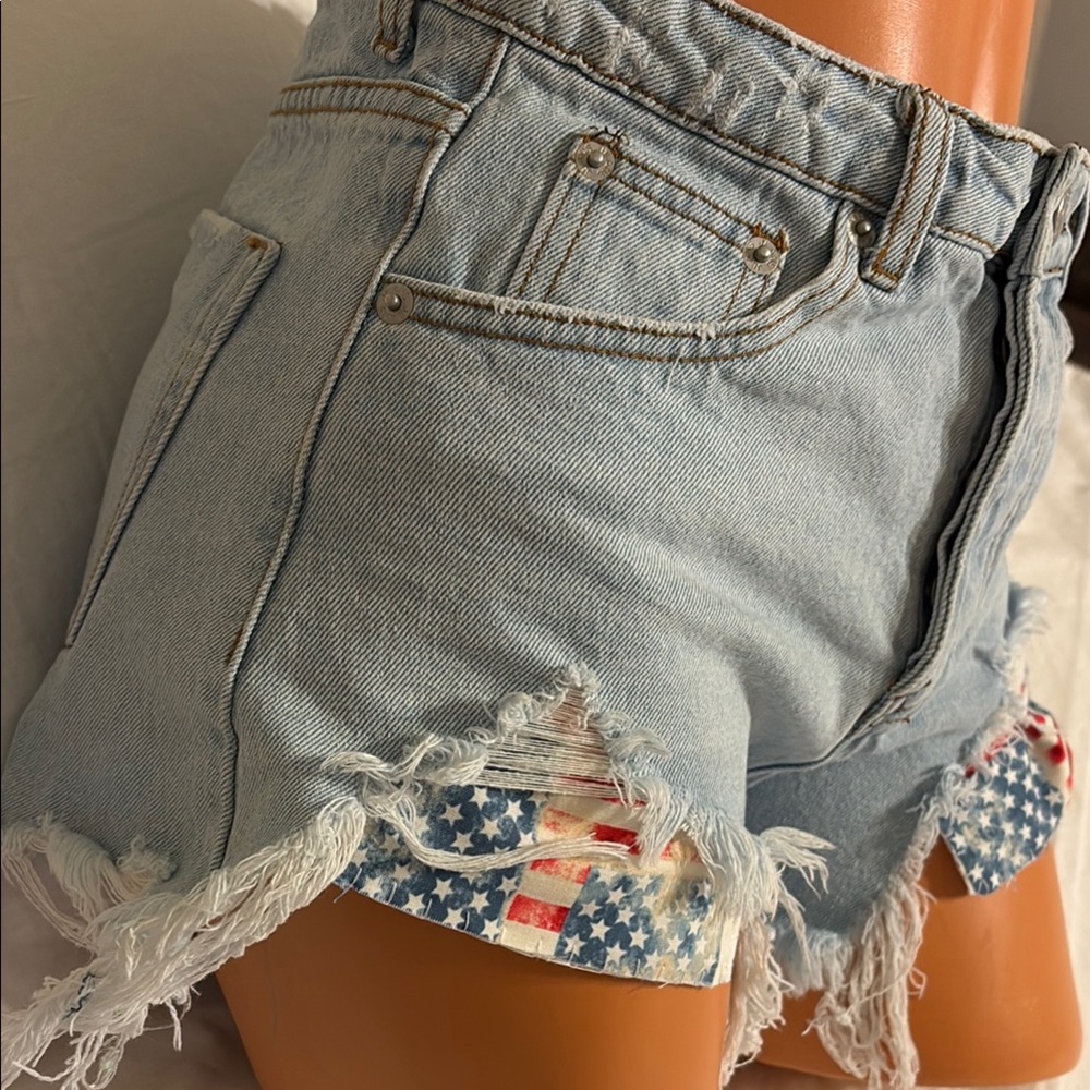 DAISY DUKES Denim Shorts with raw fringe USA American Flag pockets 28”